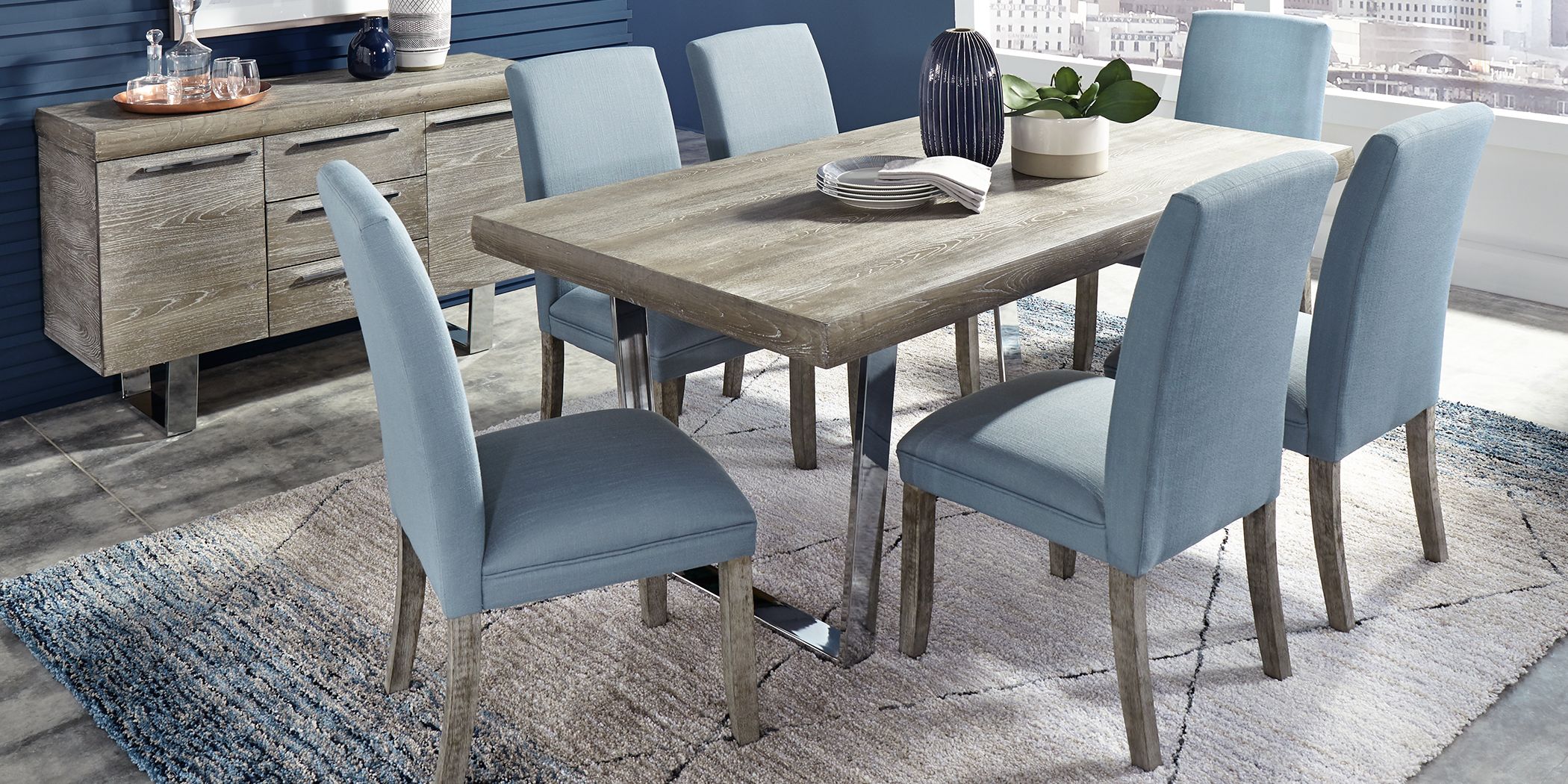 Grey dining table with blue deals chairs